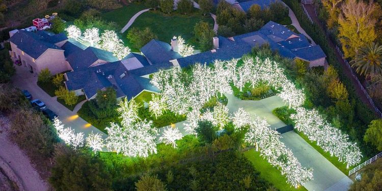 Tis the season: Kim Kardashian went all out with Christmas lights on her $60million Hidden Hills estate nestled in the west end of the San Fernando Valley