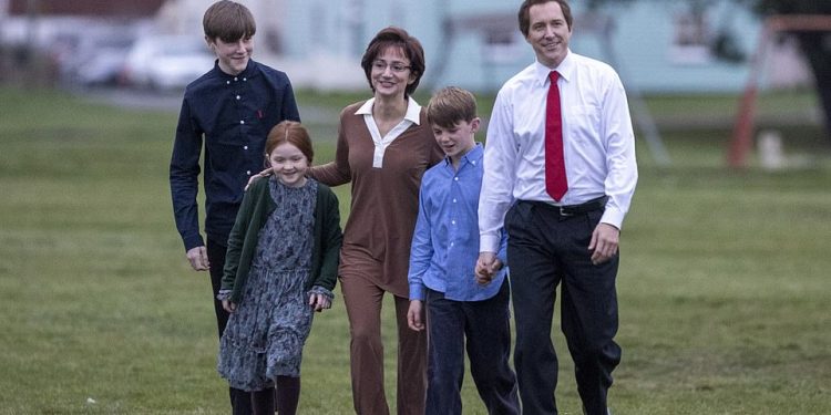 Pictured: The Crown has become the latest victim of Covid, days after the Blair family were seen on set for the first time as they filmed scenes in Kent on Tuesday (pictured Bertie Carvel and Lydia Leonard as Tony Blair and wife Cherie)