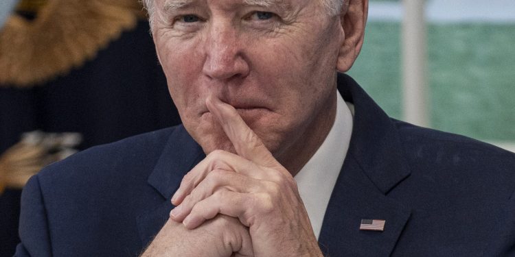 U.S. President Joe Biden listens while joining the White House Covid19 Response Team's call with the National Governors...