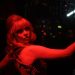 Anya Taylor-Joy poses in deep red light in Last Night in Soho