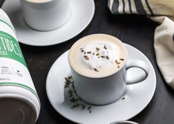 London fog latte in a white mug topped with frothed milk and lavender buds, Primal Kitchen Collagen Peptides