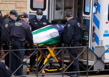 The body of police officer Jason Rivera, 22, is brought into Riverdale Funeral Home in Inwood.