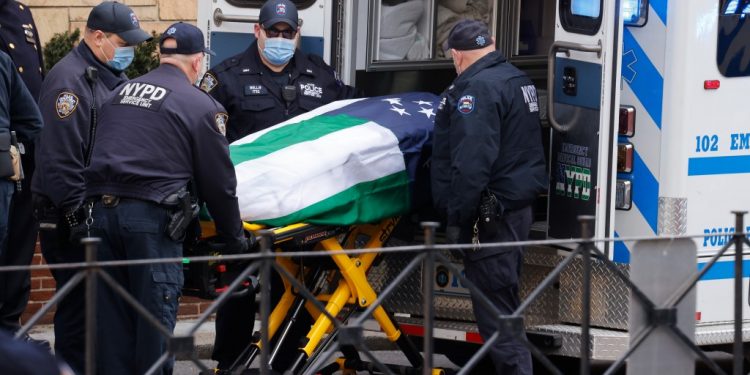 The body of police officer Jason Rivera, 22, is brought into Riverdale Funeral Home in Inwood.