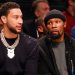 Ben Simmons sits on the Nets bench next to Kevin Durant