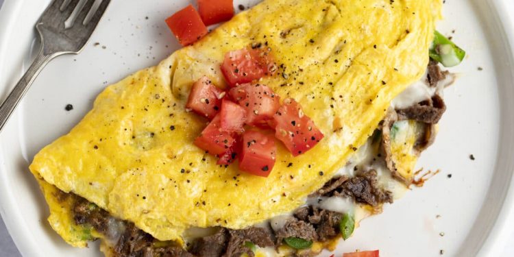 Add some excitement to breakfast time with this scrumptious, steak-filled omelette!