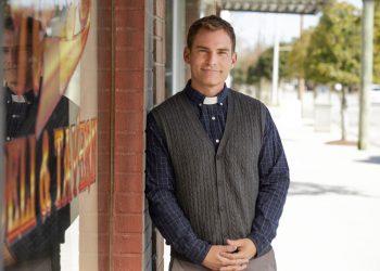 Seann William Scott in a priest collar.