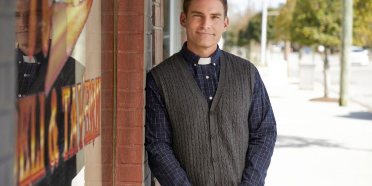 Seann William Scott in a priest collar.