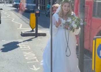 Anastasia Medvedskaya walks to Marksteen Adamson's car after she flagged him down and ask for a ride to the church.
