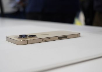 The iPhone 14 Pro, with no SIM slot on the right side.