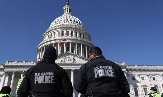 U.S. Capitol police officers gather on the east front plaza of the Capitol.