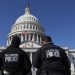 U.S. Capitol police officers gather on the east front plaza of the Capitol.