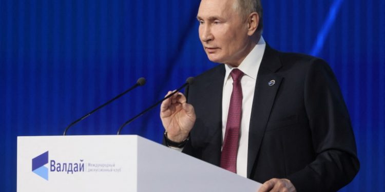 Putin speaking at podium